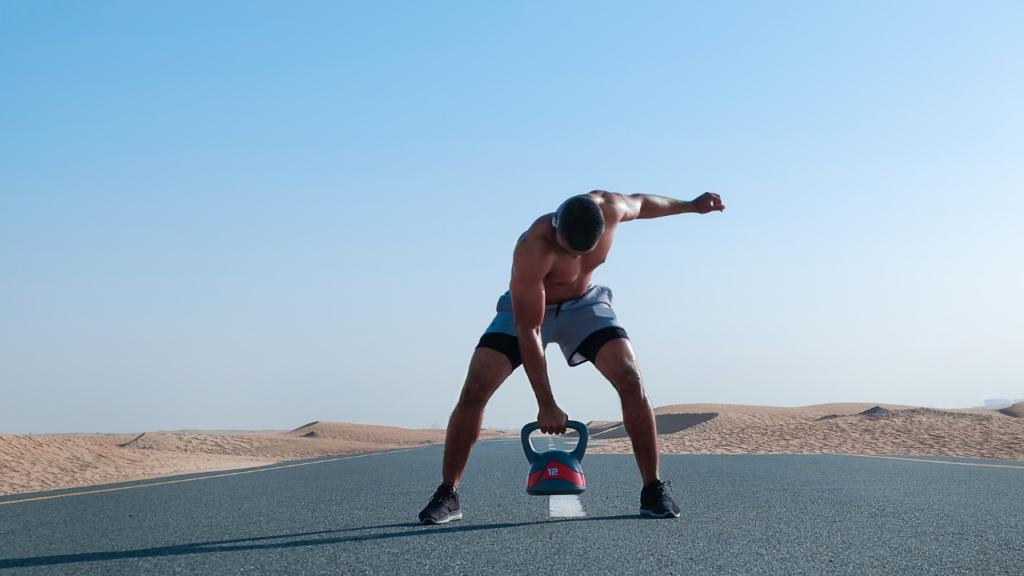 man  lifting a kettlebell for strength and weight loss