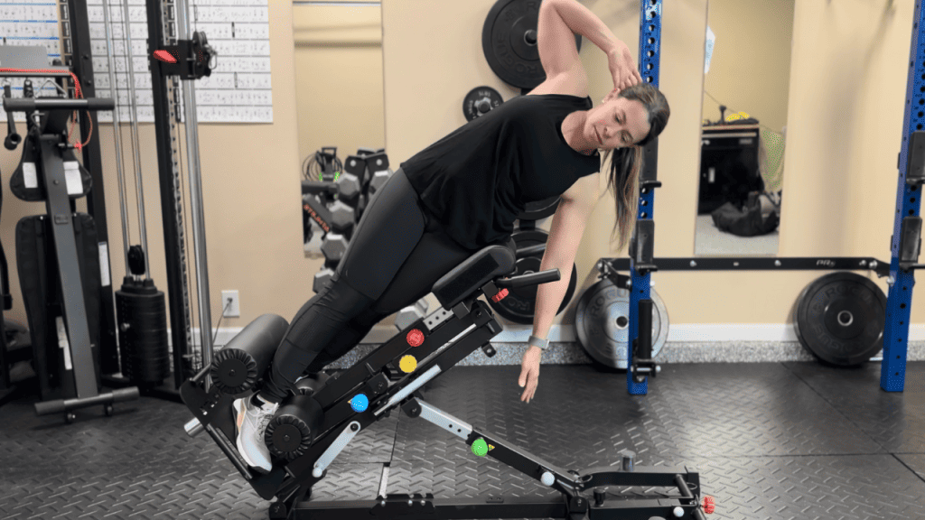 image of a woman doing QL Raises on the Nordic Hyper GHD